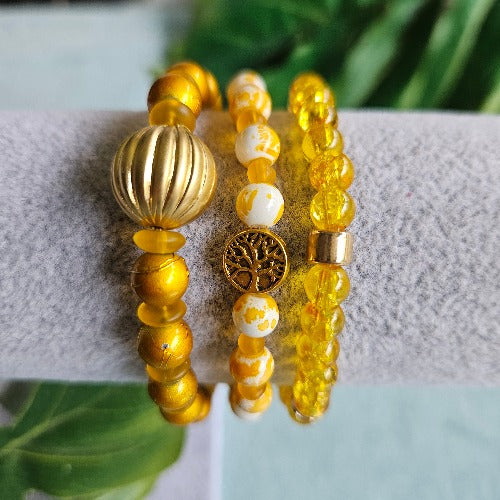 Armbänder Perlen gelb mit Lebensbaum