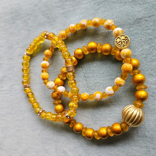 Armbänder Perlen gelb mit Lebensbaum