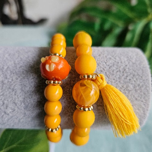 Armbänder Perlen 2er-Set orange mit Quaste
