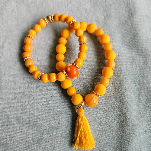 Armbänder Perlen 2er-Set orange mit Quaste