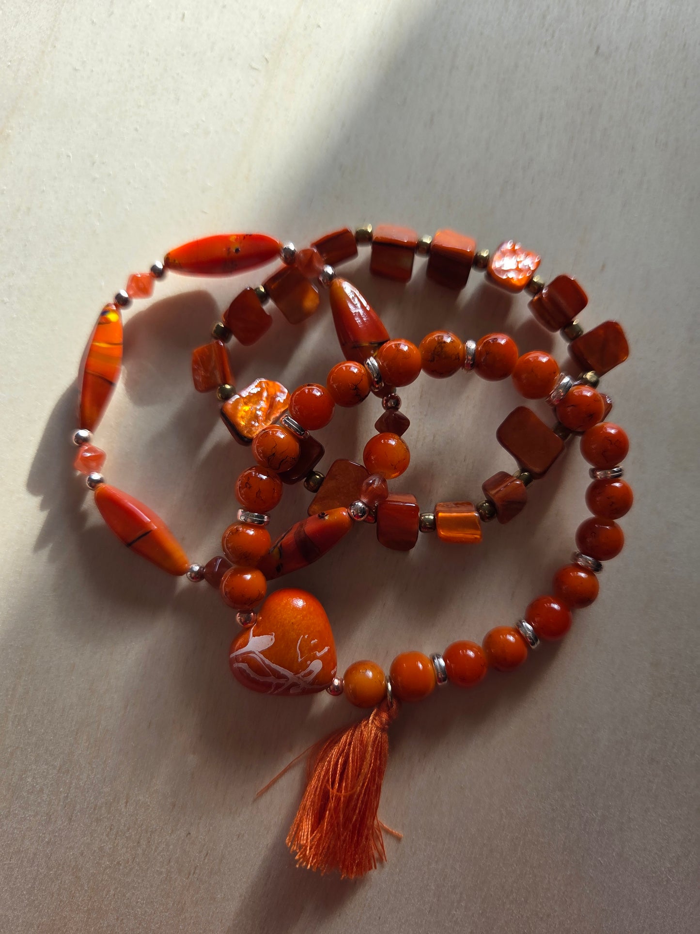 Armbänder Stein/Perlmutt Orange mit Herz 4 er Set
