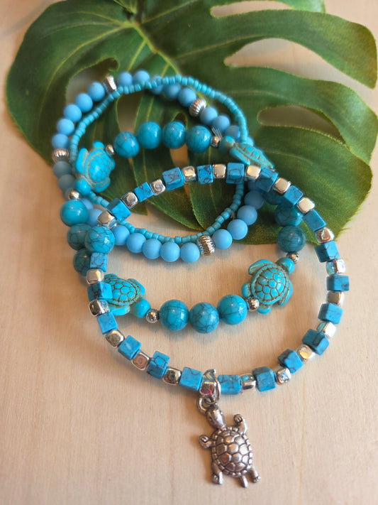 Armbänder Perlen hellblau mit Schildkröte 4 er Set