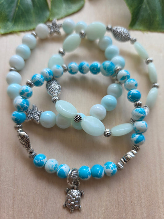 Armbänder weiß/blau mit AH Schildkröte
