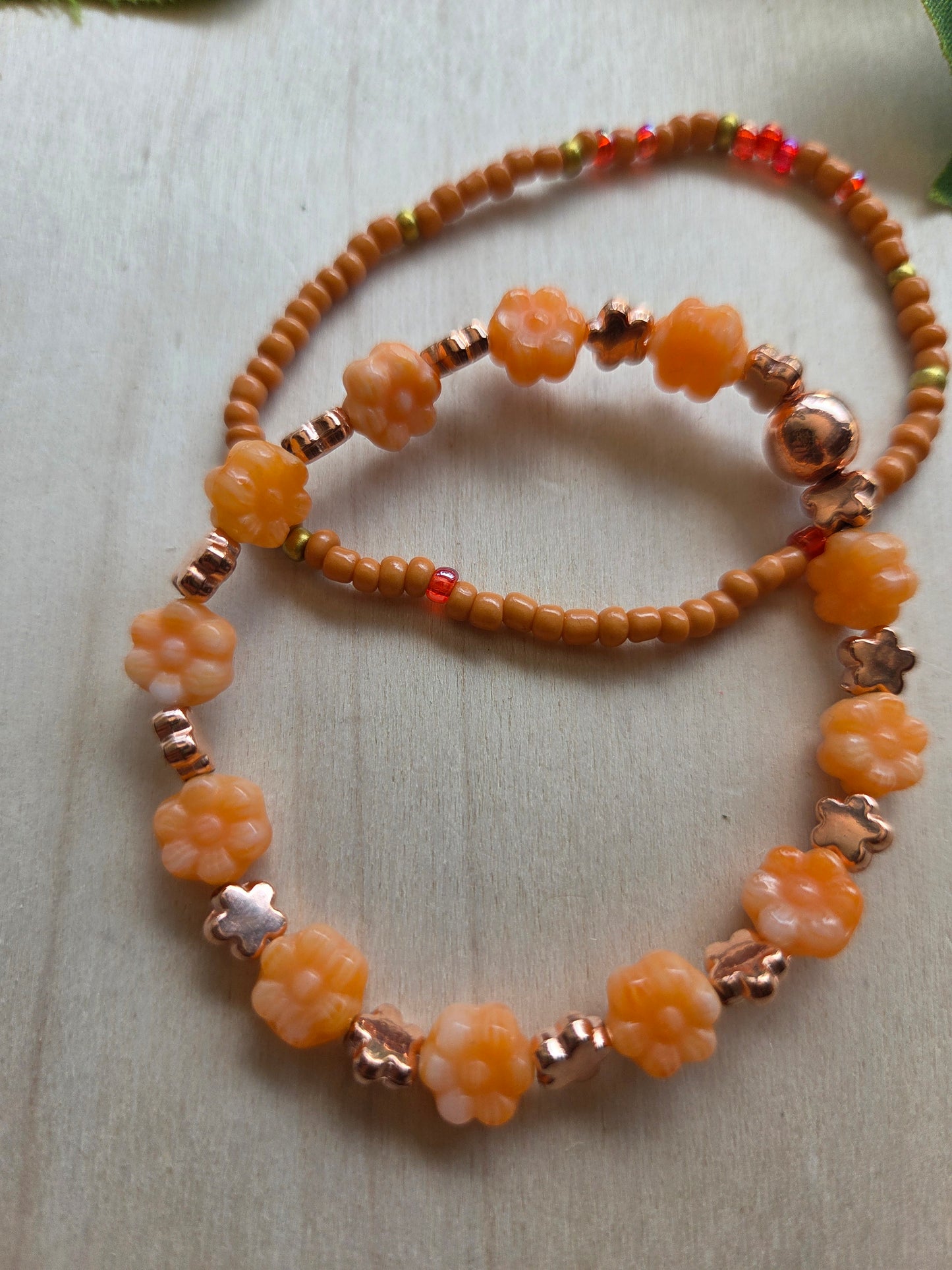 Armbänder Orange  mit Blütenperlen  4 er Set